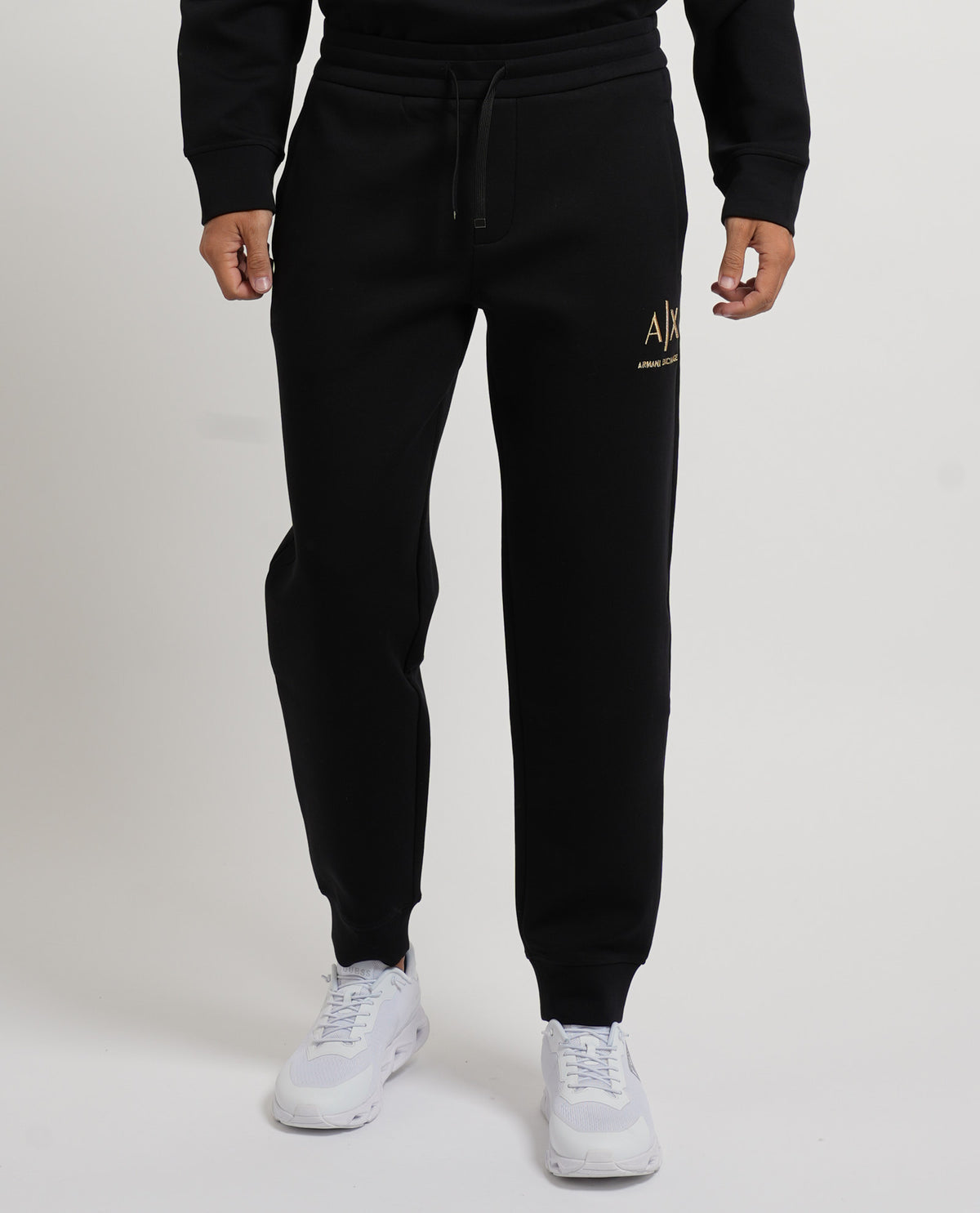 Pantaloni tuta Armani Exchange uomo con logo dorato 