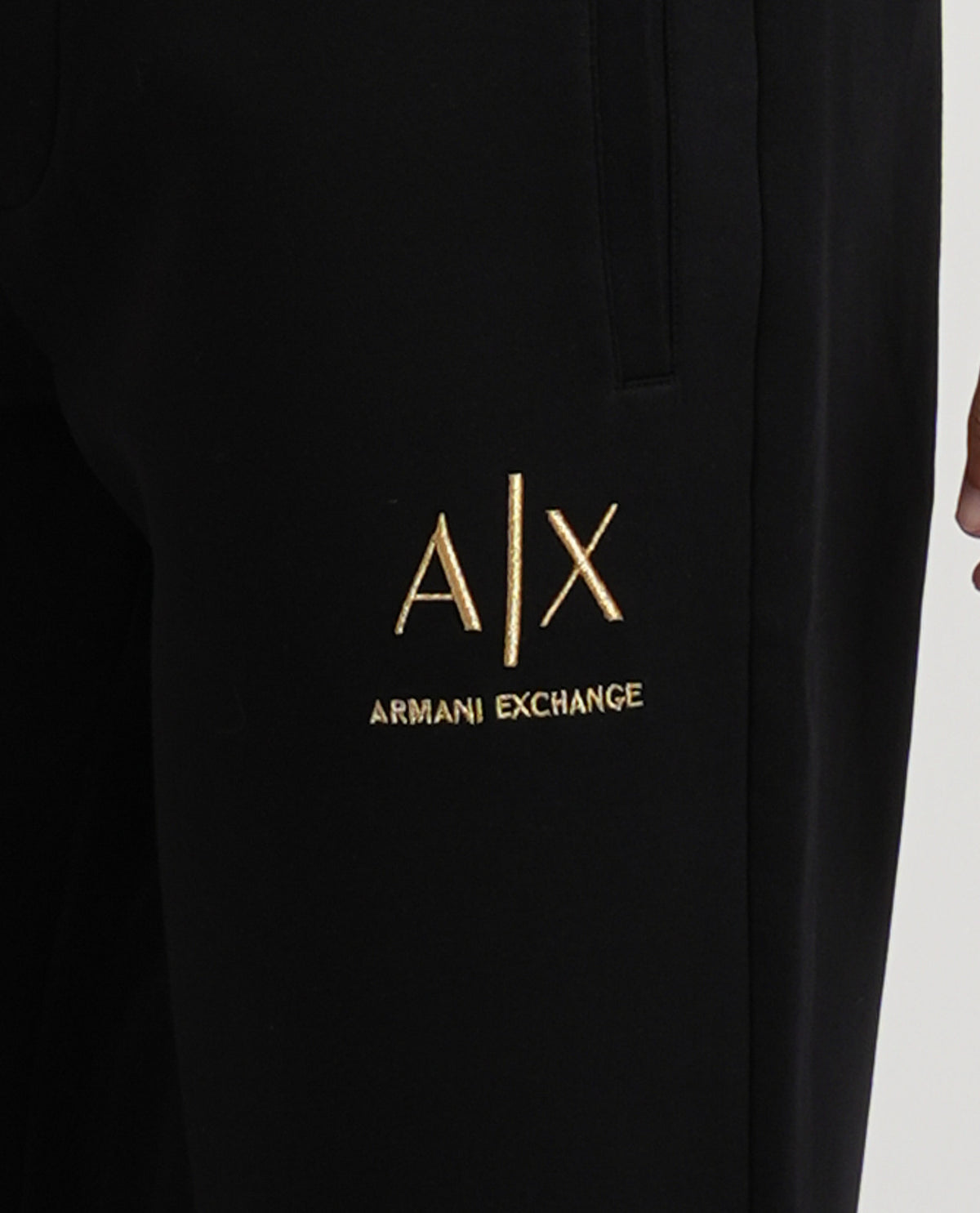 Pantaloni tuta Armani Exchange uomo con logo dorato 
